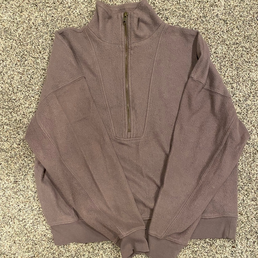 Universal Threat cropped half zip pullover.
